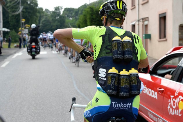 Matteo Tossato carries bottles on stage eight of the 2014 Tour de France