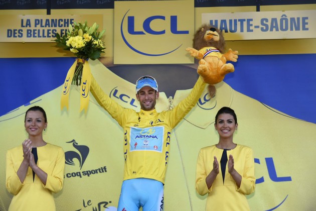 Vincenzo Nibali on the podium after winning Stage 10 of the 2014 Tour de France and regaining the yellow jersey.