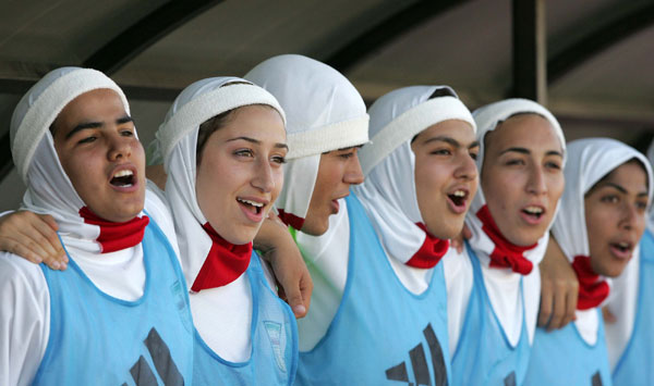 Archive footage of the Iranian women's football team, all wearing the headscarf.