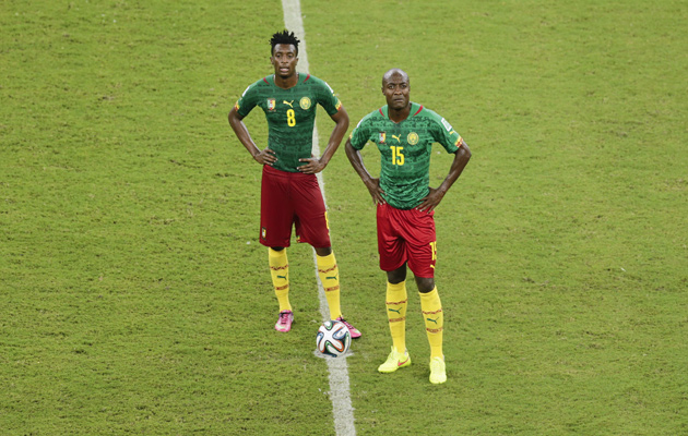 Cameroon's Benjamin Moukandjo, left, and Pierre Webo stand in the cente circle during the 4-0 defeat to Croatia.