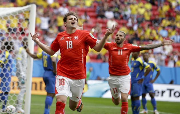 Admir Mehmedi celebrates after heading Switzerland level.