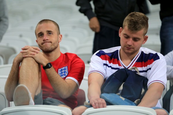 England fans are left dejected after the final whistle during the Group D match the Estadio do Sao Paulo, Sao Paulo, Brazil.