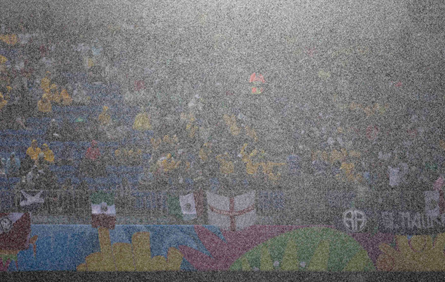 Visibility impaired... rain pours down during Mexico's match with Cameroon.