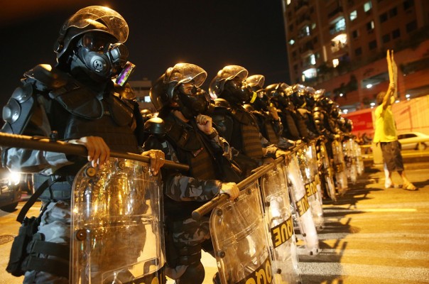 RIO DE JANEIRO, BRAZIL - JUNE 15: Military Police block anti-World Cup protestors attempting to march to Maracana stadium on June 15, 2014 in Rio de Janeiro, Brazil. Today is the fourth day of the 2014 FIFA World Cup. (Photo by Mario Tama/Getty Images)