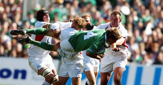 Jonny Wilkinson upends Justin Bishop of Ireland during the final game of the 2003 Six Nations