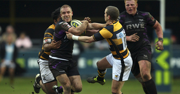 Tom Isaacs pushes past Wasp Dave Walder