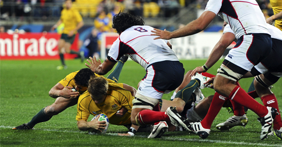 Drew Mitchell scores his team's fifth try against USA, in his first start at the World Cup after recovering from a dislocated break to the ankle