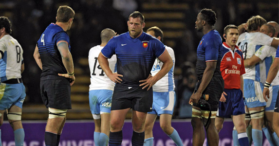 France's lock Pascal Pape (R), prop Vincent Debaty (C) look dejected after losing to Argentina