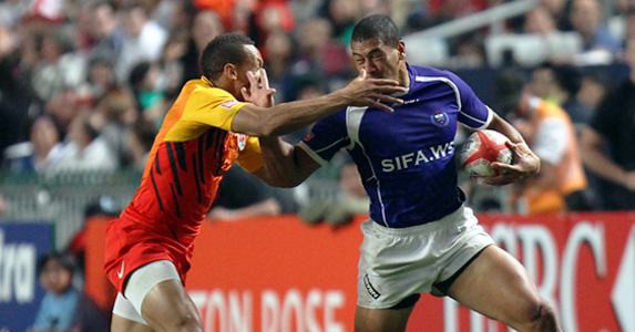Old foes: Dan Norton tackles Samoa's Paul Perez during the Hong Kong Sevens
