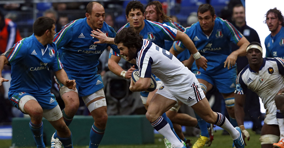 Blue wall: Maxime Machenaud tries to find his way past the Italian defence