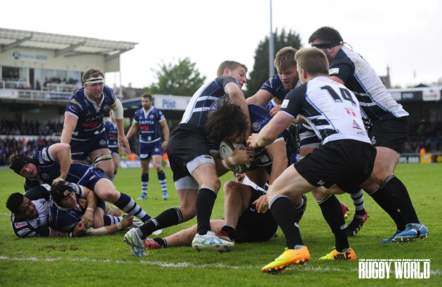 Memorial mash: Bristol's Gaston Cortes somehow gets through Titans' tackles to score