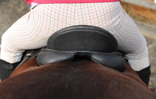 Back pain in horse riders caused by ill-fitting saddles